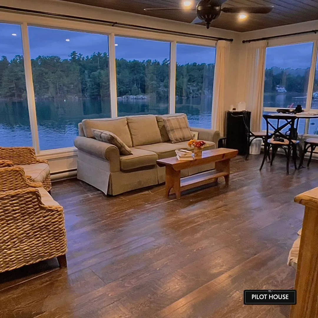 Pilot House living area with large windows facing the channel at Killarney Mountain Lodge