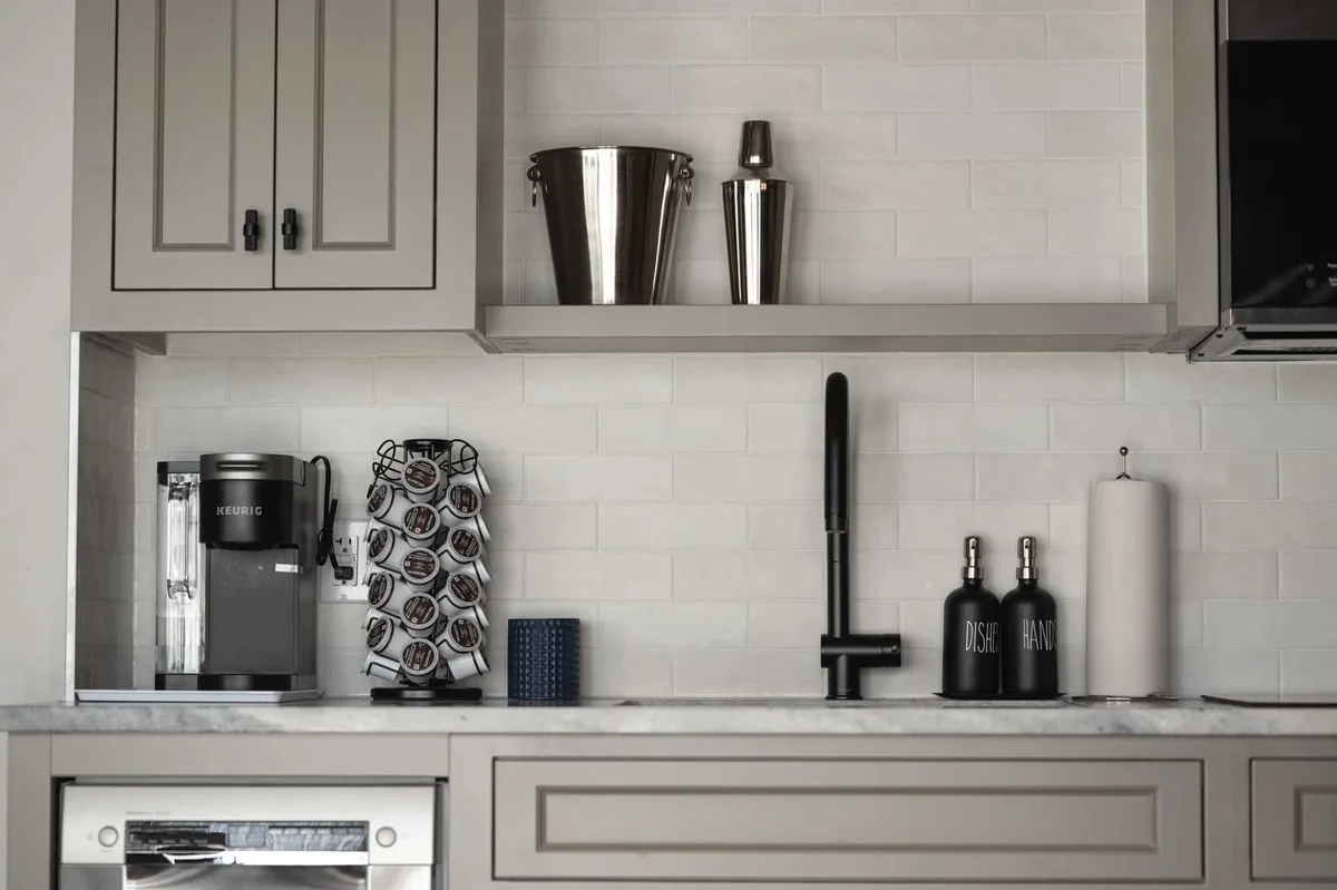 Coffee-making area and light cabinetry in a cabin kitchenette at Killarney Mountain Lodge