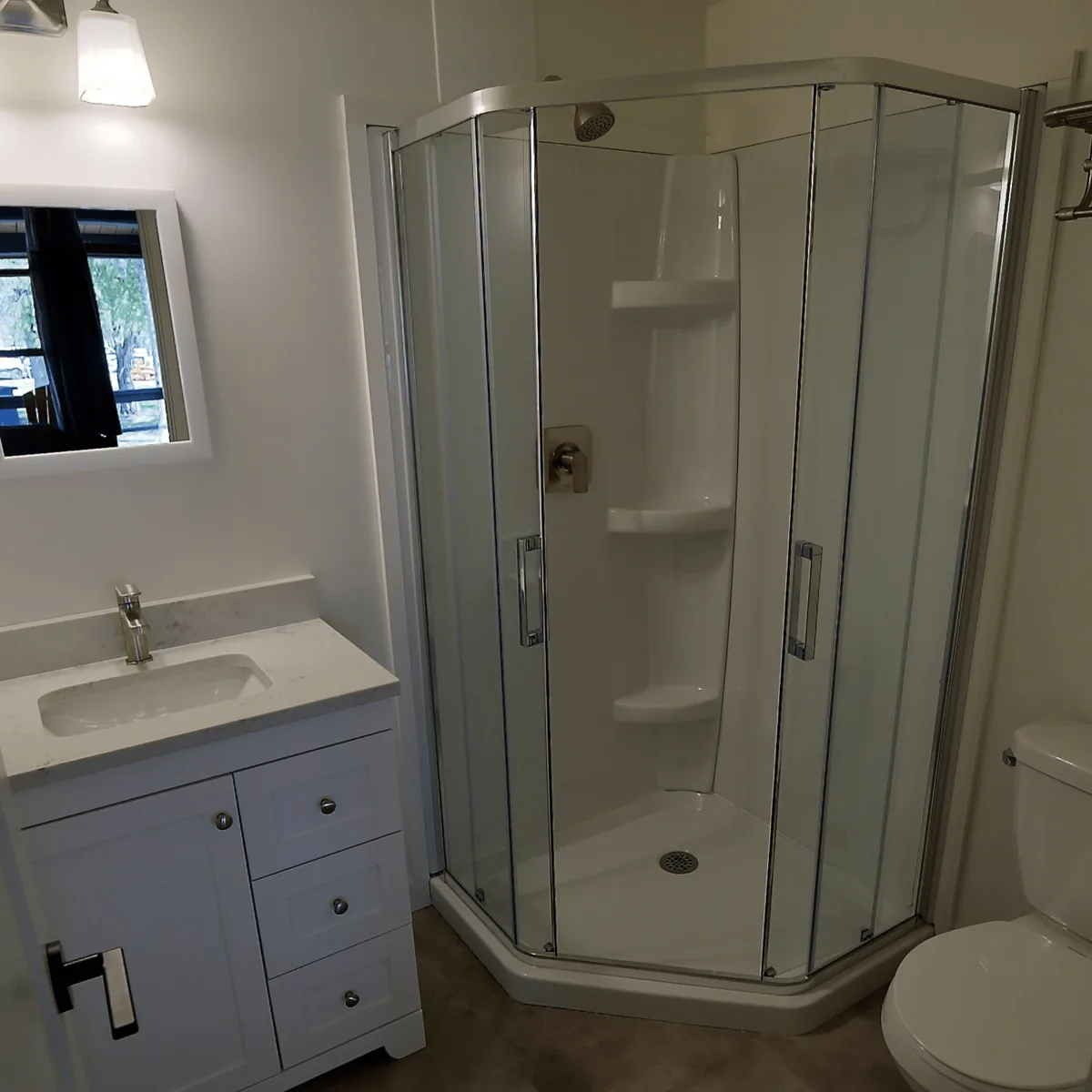 Porch Suite bathroom with a shower and white vanity at Killarney Mountain Lodge