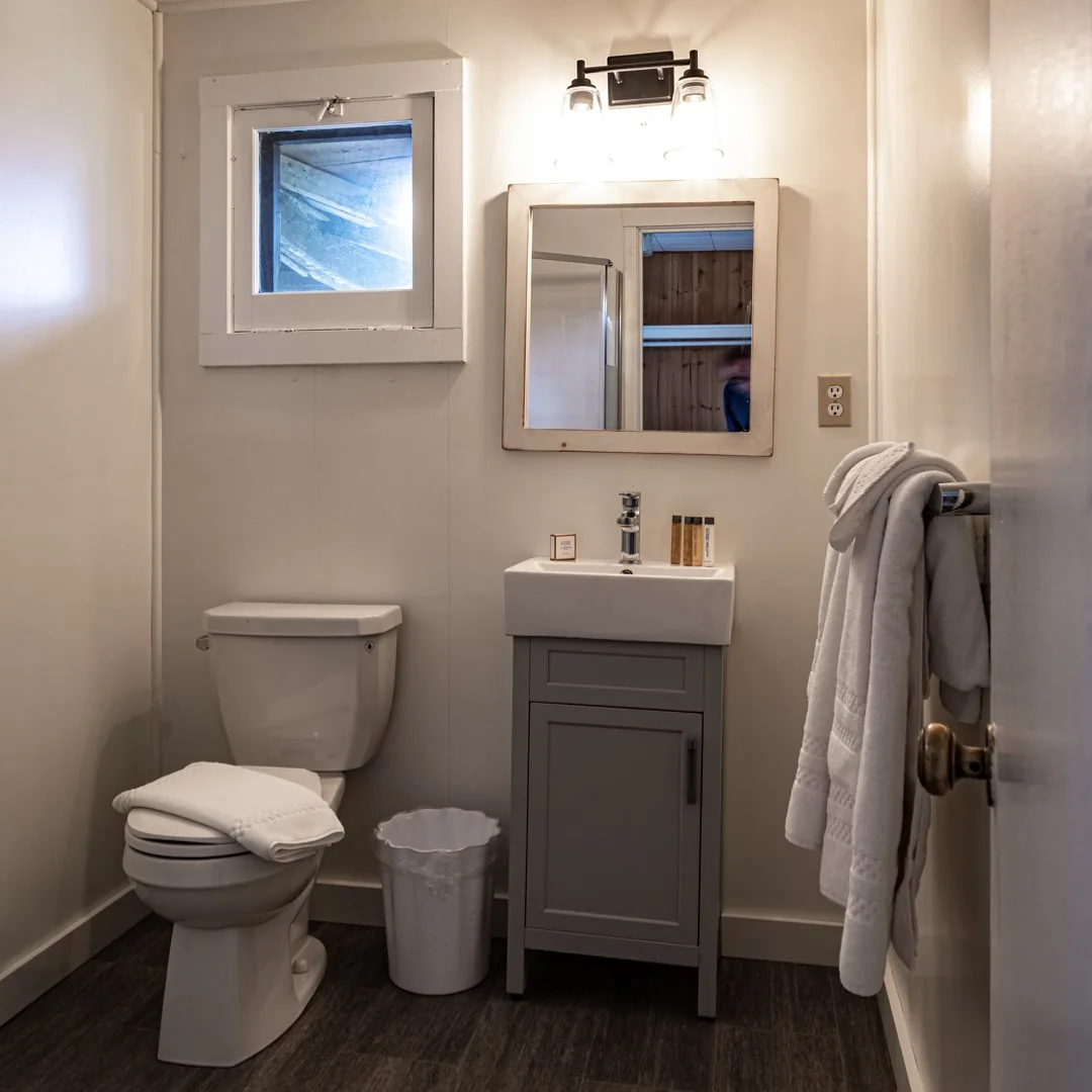 Georgian Bay Cabin bathroom with a small vanity at Killarney Mountain Lodge