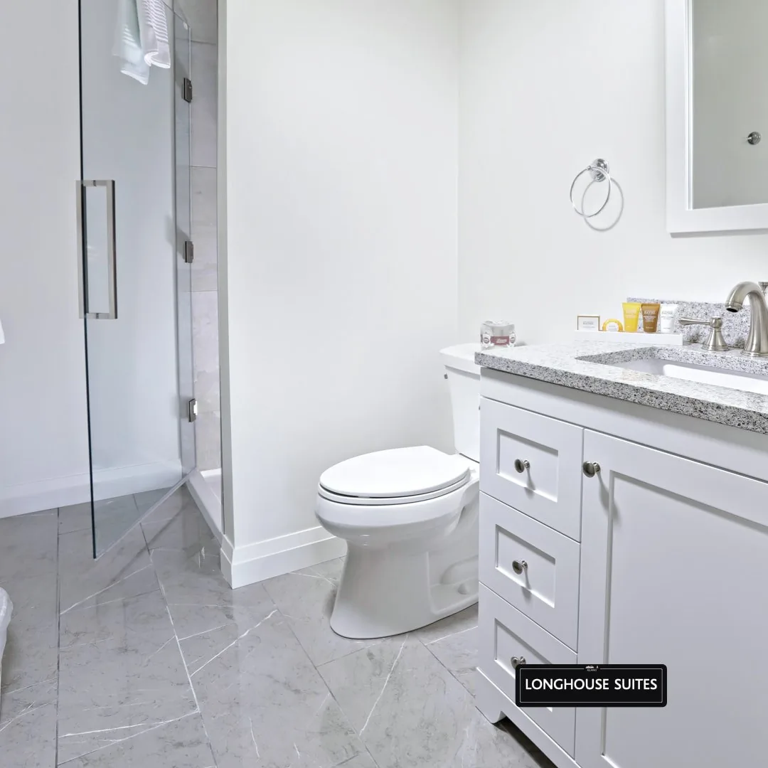 Long House Suite bathroom with a white vanity and shower at Killarney Mountain Lodge